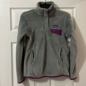 Women’s Patagonia Polartec Sweater. Size small. Gray w/ purple trim.